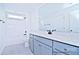 This bathroom features dual sinks, a tub-shower combo, and light gray cabinets at 4178 Millstream Rd, Denver, NC 28037