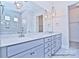 Modern bathroom featuring double vanity, pendant lights, and a tiled shower area at 4178 Millstream Rd, Denver, NC 28037
