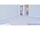Inviting bedroom featuring carpeted floors, light walls, and an open doorway to an adjacent kitchen at 4178 Millstream Rd, Denver, NC 28037