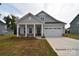Charming home with a welcoming front porch and attached two-car garage at 4178 Millstream Rd, Denver, NC 28037