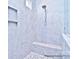 Modern shower with tiled walls, a built-in bench, and a mosaic tile floor, offering a luxurious bathing experience at 4178 Millstream Rd, Denver, NC 28037