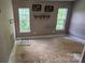Bedroom featuring natural light from two windows, with hardwood floors visible at 4227 Kiser Woods Sw Dr, Concord, NC 28025