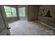 Bedroom featuring natural light from multiple windows, and hardwood floors at 4227 Kiser Woods Sw Dr, Concord, NC 28025
