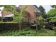 Wooden deck and backyard with lush greenery offers a private outdoor retreat at 4227 Kiser Woods Sw Dr, Concord, NC 28025