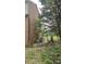 Side view of the brick house showcasing the HVAC and pool equipment, surrounded by trees at 4227 Kiser Woods Sw Dr, Concord, NC 28025