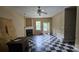 Spacious living room featuring a fireplace and a door to the backyard at 4227 Kiser Woods Sw Dr, Concord, NC 28025