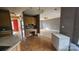 Open concept living room and kitchen area with hardwood floors at 4227 Kiser Woods Sw Dr, Concord, NC 28025