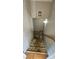 Carpeted staircase needing refurbishment with wood handrail leading to upper level at 4227 Kiser Woods Sw Dr, Concord, NC 28025