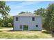 Back exterior view featuring a blue facade and green backyard at 428 Clay St, Mooresville, NC 28115