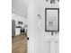 Clean bathroom features a pedestal sink with a view into the bright kitchen area at 428 Clay St, Mooresville, NC 28115