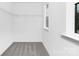 This closet has gray carpet, a window and white wire shelving at 428 Clay St, Mooresville, NC 28115