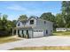 Features a blue two-story exterior, a garage, manicured lawn, and contemporary curb appeal at 428 Clay St, Mooresville, NC 28115