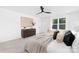 Spacious main bedroom with a ceiling fan, large window and soft neutral color scheme at 428 Clay St, Mooresville, NC 28115