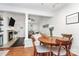 Dining area adjacent to the living room with hardwood floors and natural light at 433 W 8Th Street St, Charlotte, NC 28202