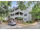 Attractive building exterior with multi-level balconies, brick accents, and lush landscaping at 433 W 8Th Street St, Charlotte, NC 28202