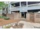 Inviting building exterior featuring brick accents, landscaped grounds, and convenient stair access to upper units at 433 W 8Th Street St, Charlotte, NC 28202