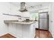 Well-lit kitchen with stainless steel appliances, granite countertops, and a functional layout at 433 W 8Th Street St, Charlotte, NC 28202