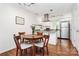 Modern kitchen with stainless steel appliances, granite countertops, and a dining area at 433 W 8Th Street St, Charlotte, NC 28202