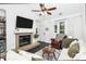 Cozy living room with a fireplace, hardwood floors, and large windows at 433 W 8Th Street St, Charlotte, NC 28202