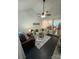 Cozy living room with a modern sofa, leather armchair, and open access to the kitchen and dining area at 433 W 8Th Street St, Charlotte, NC 28202