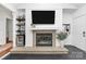 Inviting living room featuring a fireplace, built-in bar, and stylish finishes at 433 W 8Th Street St, Charlotte, NC 28202