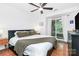 Bright main bedroom with a ceiling fan, access to a private balcony, and hardwood floors at 433 W 8Th Street St, Charlotte, NC 28202