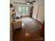 Bright office space with a desk, chair, shelves, and a large window overlooking the lush outdoors at 433 W 8Th Street St, Charlotte, NC 28202