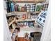 Walk-in pantry offering ample storage space with wooden shelving, and household essentials at 433 W 8Th Street St, Charlotte, NC 28202