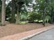 Beautiful community park with mature trees, benches, walking paths, and a brick sidewalk for leisurely strolls at 433 W 8Th Street St, Charlotte, NC 28202