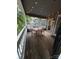 Charming patio with a wooden table, four chairs, a railing, and ambient string lights for relaxing evenings at 433 W 8Th Street St, Charlotte, NC 28202