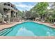 Resort-style pool area with lounge chairs, tables, and lush greenery, creating a relaxing and inviting atmosphere at 433 W 8Th Street St, Charlotte, NC 28202