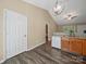 Kitchen area with wood cabinets, granite counters, stainless sink and modern lighting fixture at 471 Hillandale Ne St, Concord, NC 28025