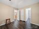 Open-concept living space with wood floors, connecting to the kitchen and bathroom at 471 Hillandale Ne St, Concord, NC 28025