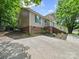 Home exterior with a long driveway and well-maintained lawn, showcasing a cozy and inviting atmosphere at 471 Hillandale Ne St, Concord, NC 28025
