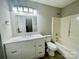 Bright bathroom with modern vanity, sleek fixtures, and combined shower and tub at 5800 Silver Eagle Dr, Charlotte, NC 28214