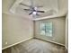 Cozy bedroom with carpet flooring and ceiling fan, bathed in natural light at 5800 Silver Eagle Dr, Charlotte, NC 28214