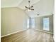 Spacious bedroom with vaulted ceiling, fan, and lots of natural light at 5800 Silver Eagle Dr, Charlotte, NC 28214