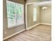 Bright room with wood-look floors and dining chandelier at 5800 Silver Eagle Dr, Charlotte, NC 28214