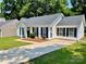 Charming single-story home with a well-maintained lawn and a concrete driveway at 5800 Silver Eagle Dr, Charlotte, NC 28214