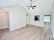 Bright living room featuring vaulted ceilings, wood-look floors, and ample natural light at 5800 Silver Eagle Dr, Charlotte, NC 28214