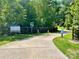 Eagles Landing Park featuring a walking path surrounded by lush trees at 5800 Silver Eagle Dr, Charlotte, NC 28214