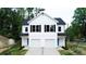 Beautiful new construction duplex featuring a bright white facade and garage at 619 Billingsley Rd, Charlotte, NC 28211