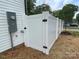 Close up of a newly installed white vinyl fence on the side of the home at 619 Billingsley Rd, Charlotte, NC 28211