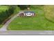 Aerial view of charming home with a large front yard and driveway at 6219 Heavner Rd, Vale, NC 28168