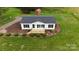 An aerial view of a charming house with a freshly cut lawn at 6219 Heavner Rd, Vale, NC 28168