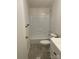 This bathroom features a white tub and shower combo with a white toilet and vanity at 6219 Heavner Rd, Vale, NC 28168