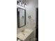 Bathroom featuring a white vanity and mirror with a black frame at 6219 Heavner Rd, Vale, NC 28168