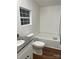 Bathroom boasting a soaking tub with a sleek single window and granite countertop vanity at 6219 Heavner Rd, Vale, NC 28168