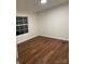 This bedroom offers wood-style floors, a window for natural light, and ample space at 6219 Heavner Rd, Vale, NC 28168