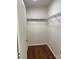 Walk-in closet with wood-style floors and ventilated shelving for optimal storage and organization at 6219 Heavner Rd, Vale, NC 28168